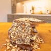 Candy by Grant – The Front View of Our Dark Chocolate Pecan Toffee Showing the Chopped Pecans, Thickness of the Candy Layer and Decadent Dark Chocolate. Amazing! For Sale Online and Available Locally in Waukesha, WI. We may be biased, but we think this is the best toffee you will taste.